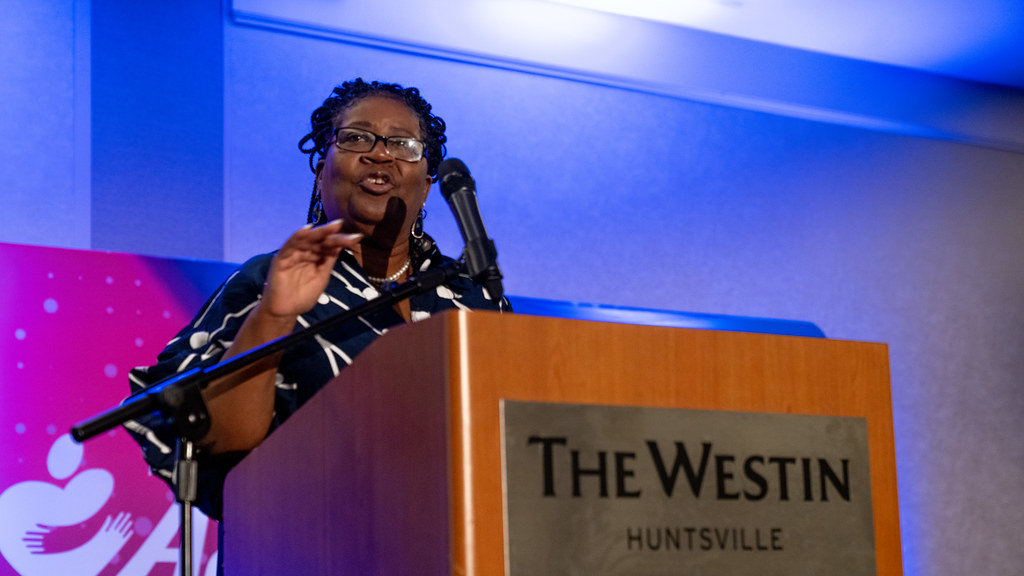 A speaker at The Westin Huntsville podium in the main ballroom