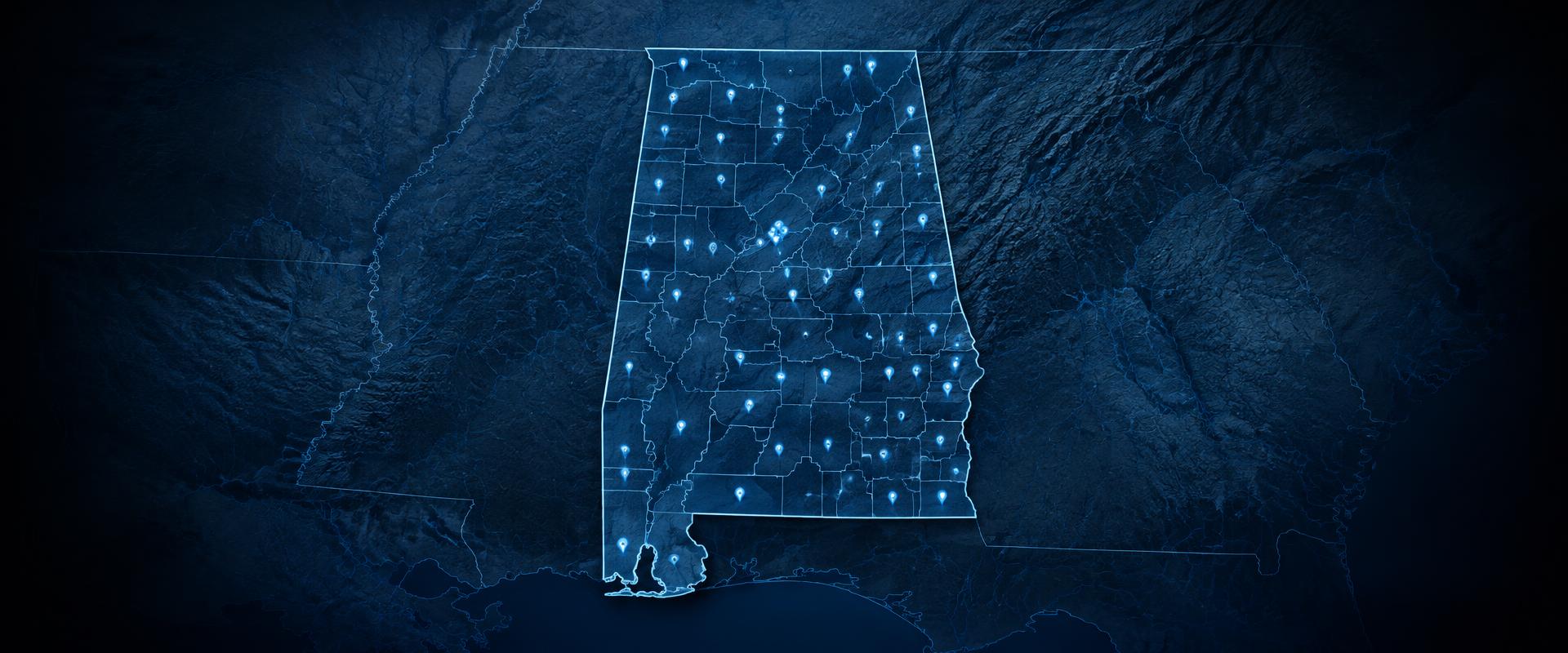 Wall map of Alabama marked with agency location pins